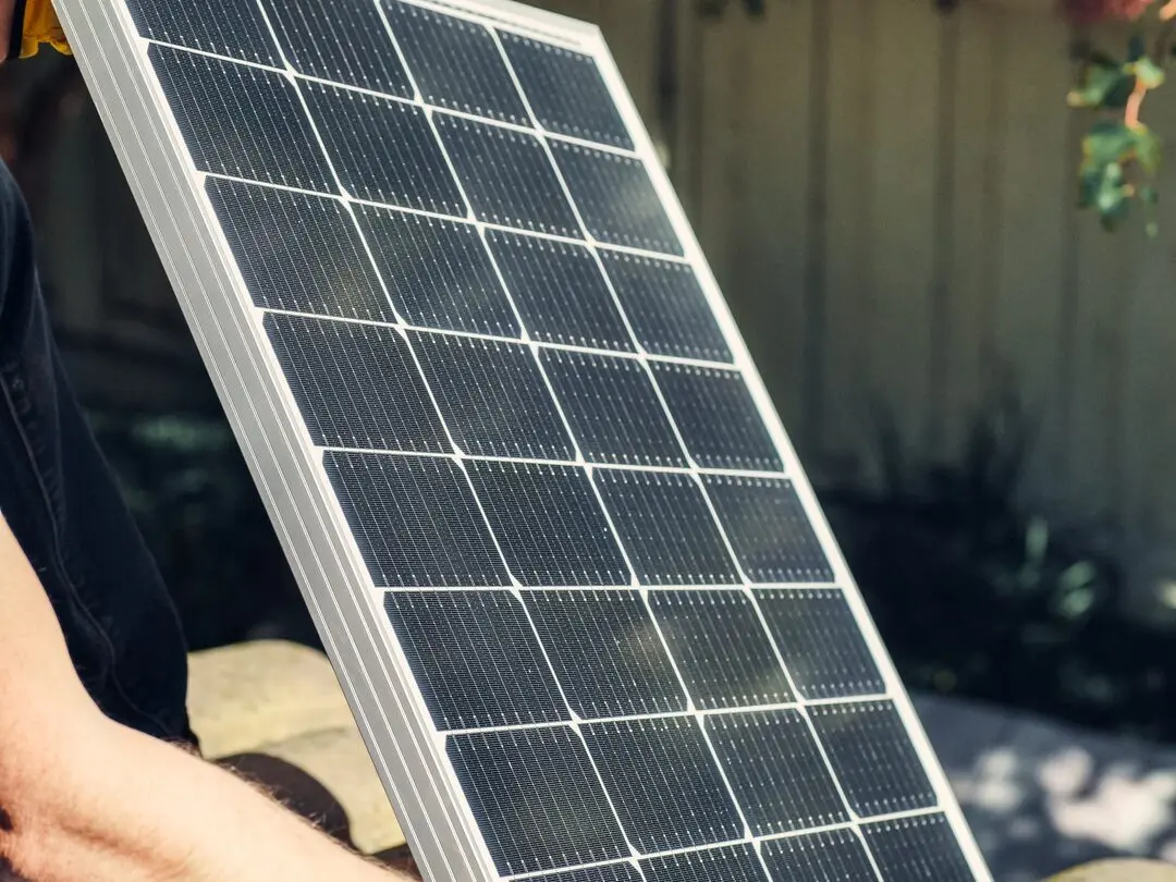 Close up of a solar panel being handled on site